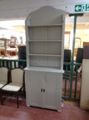 A painted antique pine dresser fitted double door cupboards beneath