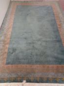 A green fringed woolen carpet,
