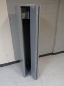 A metal gun cabinet with keys