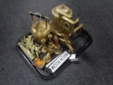A box of antique and later brass wares including kettle, pair of fire dogs, hand bell,