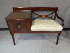 A reproduction Chippy telephone table/seat