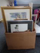 A box of miscellaneous pictures, hot plate,