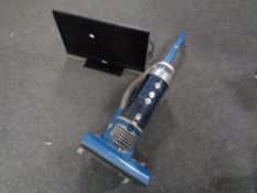 A Hoover upright vacuum together with a Altius 24