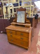 An antique pine dressing chest