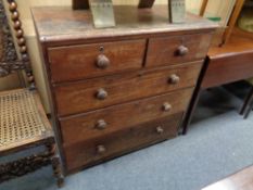 A Victorian pine five drawer chest with knob handles