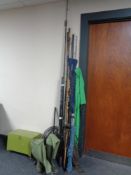 A bundle of sea fishing rods, two rod stands, a fishing box,
