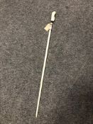 An antique carved ivory walking stick with bird to pommel, length 82 cm.