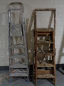 Two sets of folding wooden steps together with two sets of aluminium steps