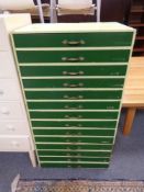 An early 20th century painted pine fourteen drawer music chest