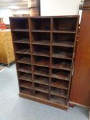 A set of early 20th century pigeon hole shelves fitted twenty four compartments, height 148 cm,