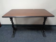 A 20th century rectangular bar table on cast iron legs