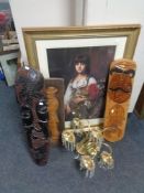 A gilt framed print of a girl with flowers, three carved wooden panels,