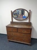 An Edwardian oak dressing chest