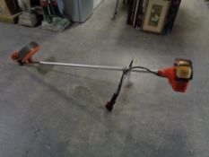 An Echosrm-3600 petrol strimmer with harness