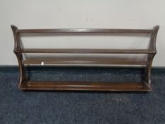 An Ercol wall shelf, width 97 cm, height 50 cm.