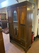 An Edwardian inlaid mahogany mirror door wardrobe