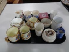 A box of 20th century commemorative china and a Royal Cauldon blue and white milk jug,