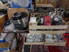 A crate of plated wares, cutlery, candle holders,