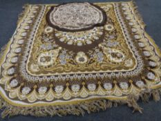 A 1970's chain stitch floral carpet on brown ground together with a further circular chain stitch