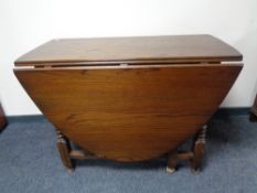 A 20th century oak gate leg table