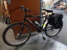 A Raleigh Max mountain bike with rear panniers