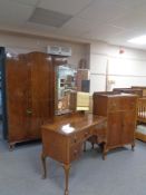 A 1930's three piece walnut bedroom suite comprising of single door wardrobe,