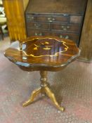 An Italiante pedestal wine table