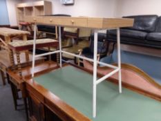 A contemporary Ikea three drawer writing table on metal legs