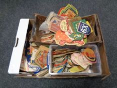 A box of vintage beer mats