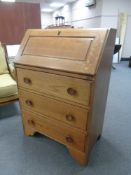 A 1930's oak writing bureau