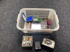 A basket of thimble case and thimbles, ceramic egg,