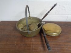 A brass handled jam pan, bed warming pan,
