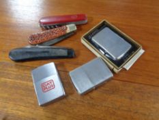 Three Zippo lighters, one boxed,