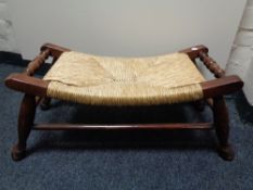 A stained beech rush seated stool