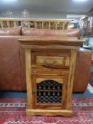 A mango wood single door cabinet