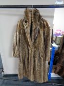 A lady's full length fox fur coat