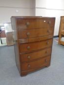 A 1930's oak five drawer bowfronted chest