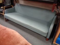 A mid 20th century Danish settee upholstered in a blue fabric CONDITION REPORT: