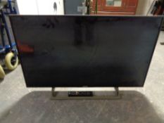 A Sony Bravia model KD-43XE8005 LCD TV (with remote,