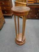 An early 20th century mahogany torchere