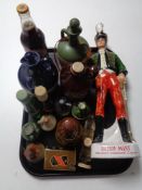 A tray of quantity of whisky and cider decanters, whisky miniatures,