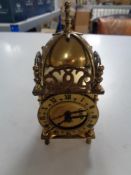 A Smiths brass lantern clock