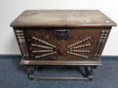 A late 18th century oak storage chest on stand