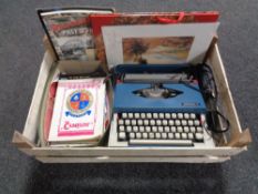 A crate containing cased Imperial 220 typewriter, assorted theatre programmes,