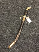 A reproduction naval dirk in sheath