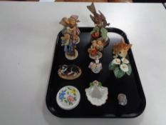 A tray of West German Hummel figures, Danish figure of an otter,