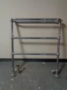 A chrome bathroom towel rail