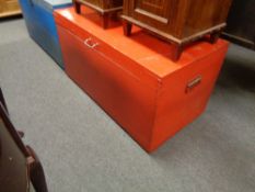 A red painted pine blanket box