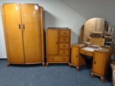 A 1930's oak three piece bedroom suite