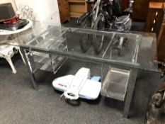 A contemporary glass topped twin pedestal desk on metal base